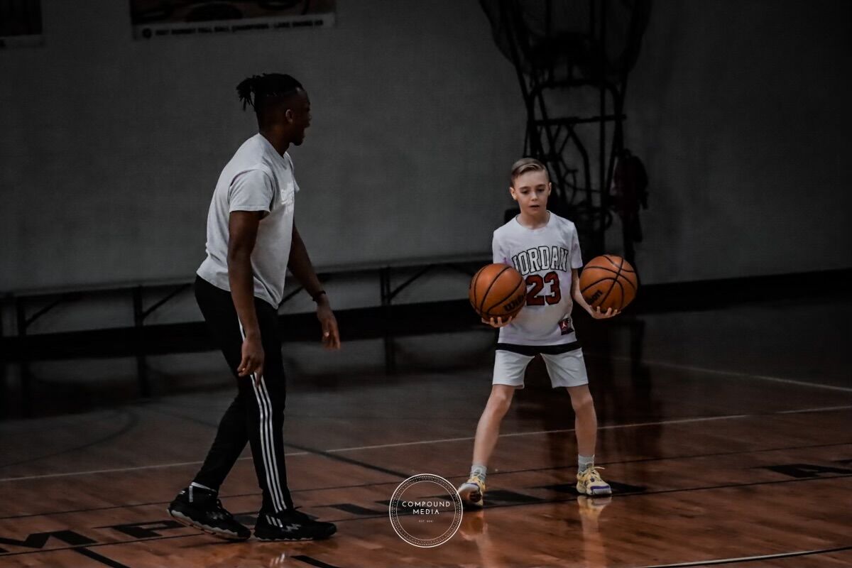 Trevor coaching youth athlete
