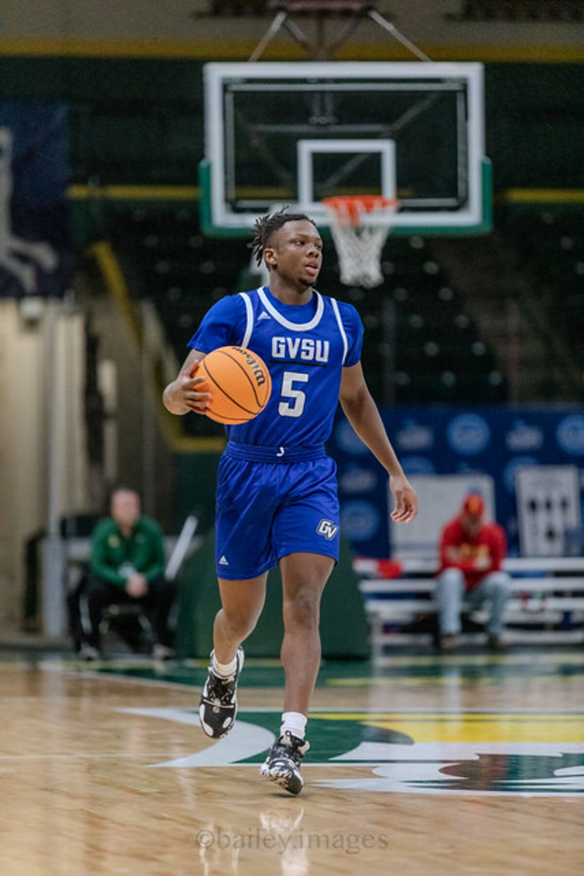 Trevor dribbling in blue